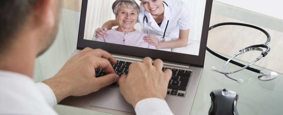 Doctor Video Chatting With Nurse And Patient Doctor Video Chatting With Nurse And Patient