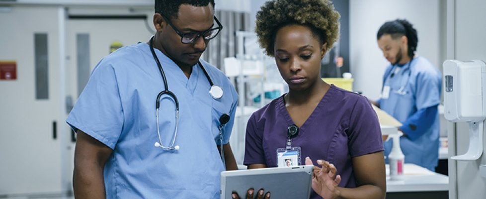 Nurse is using digital tablet in hospital Nurse is using digital tablet in hospital