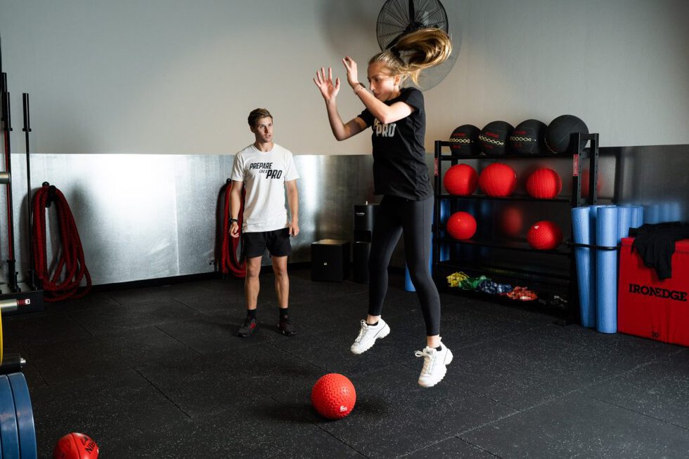 Woman working out in a private gym.