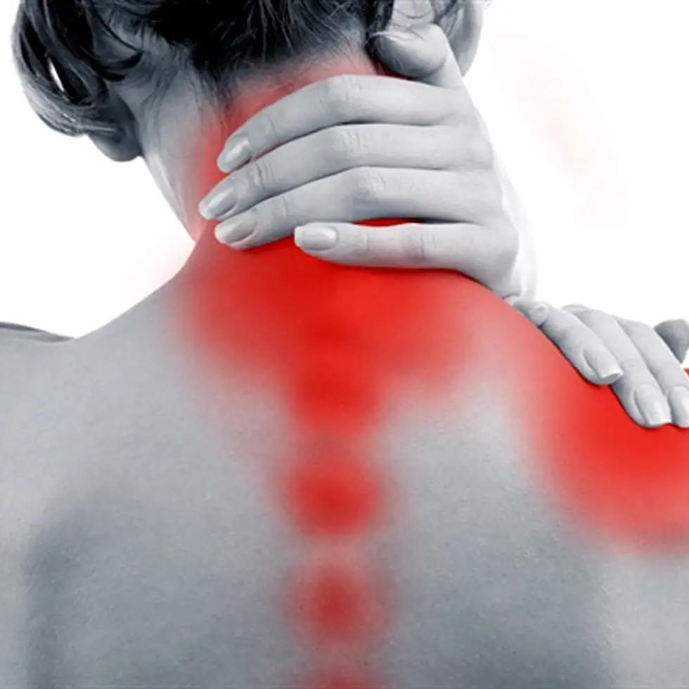 Woman holding her shoulder in discomfort before receiving Photobiomodulation Therapy (PBMT) at BionwoRx Center for Functional and Regenerative Medicine in Carmel, Indiana.