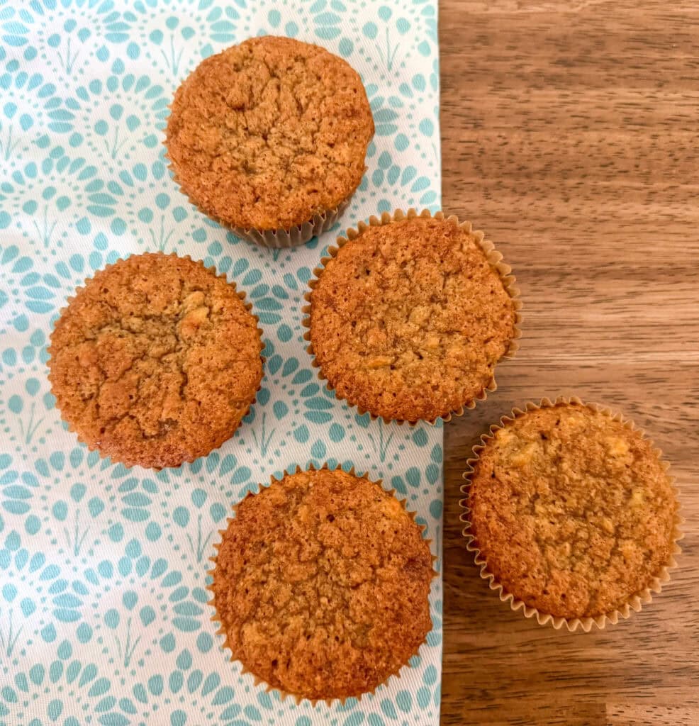 einkorn banana muffins on turquoise patterned kitchen mat