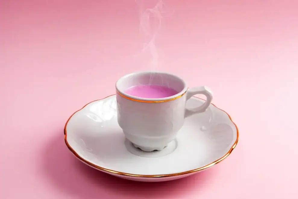 A cup of tea on a table in a garden