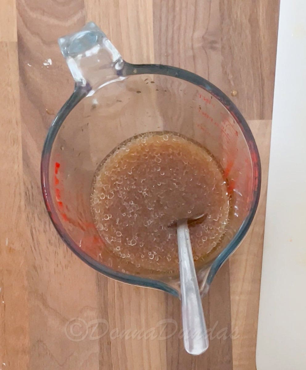 orange and honey sauce in jug.