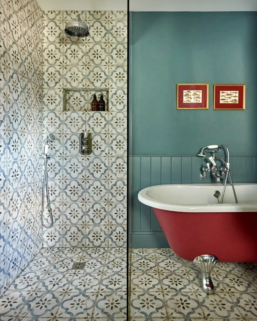 Bathroom wood panelling painted in Farrow & Ball De Nimes with red clawfoot tub in Radicchio