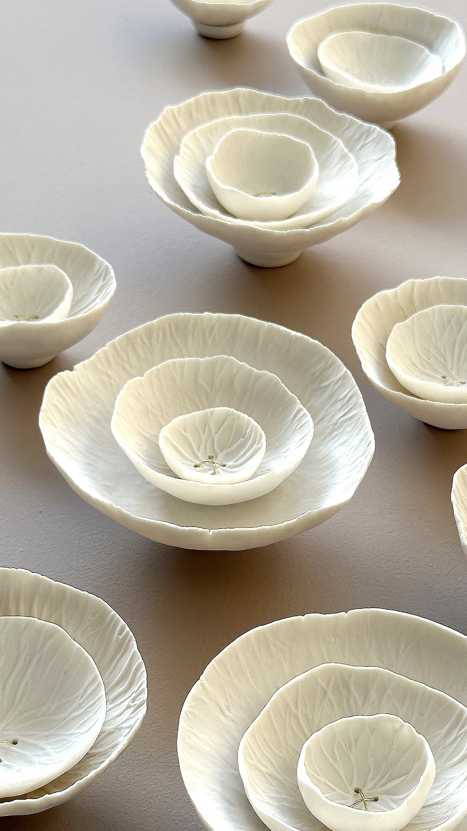 Porcelain and gold 3D wall art cluster, contemporary ceramic sculpture for interior design.