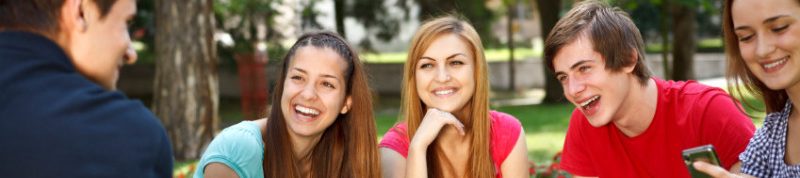 Young college students relaxing outdoors