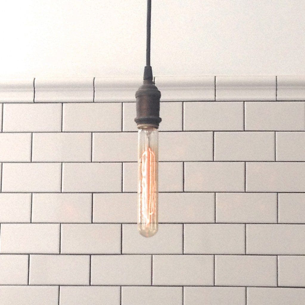 Two trends in one look: Edison bulb with white subway tile MyFixitUpLife