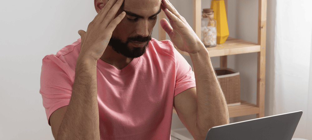 Man sitting with head in hands