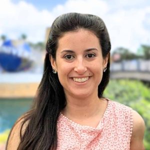Portrait of a smiling woman at 407 Vacation Co., promoting Florida vacation rentals and travel experiences.