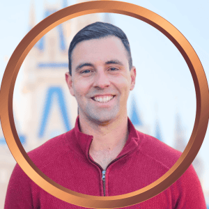 Friendly traveler in front of iconic Orlando landmark, representing expert vacation planning services.