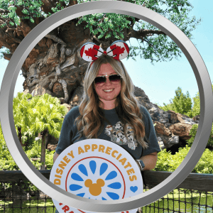 Enjoying a fun day at Disney's Animal Kingdom with themed accessories and a cheerful smile.