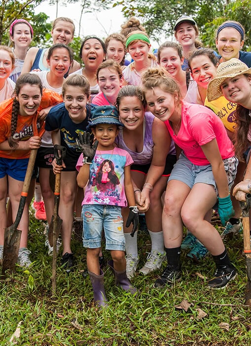 A Service Learning group posing together after planting trees in Costa Rica