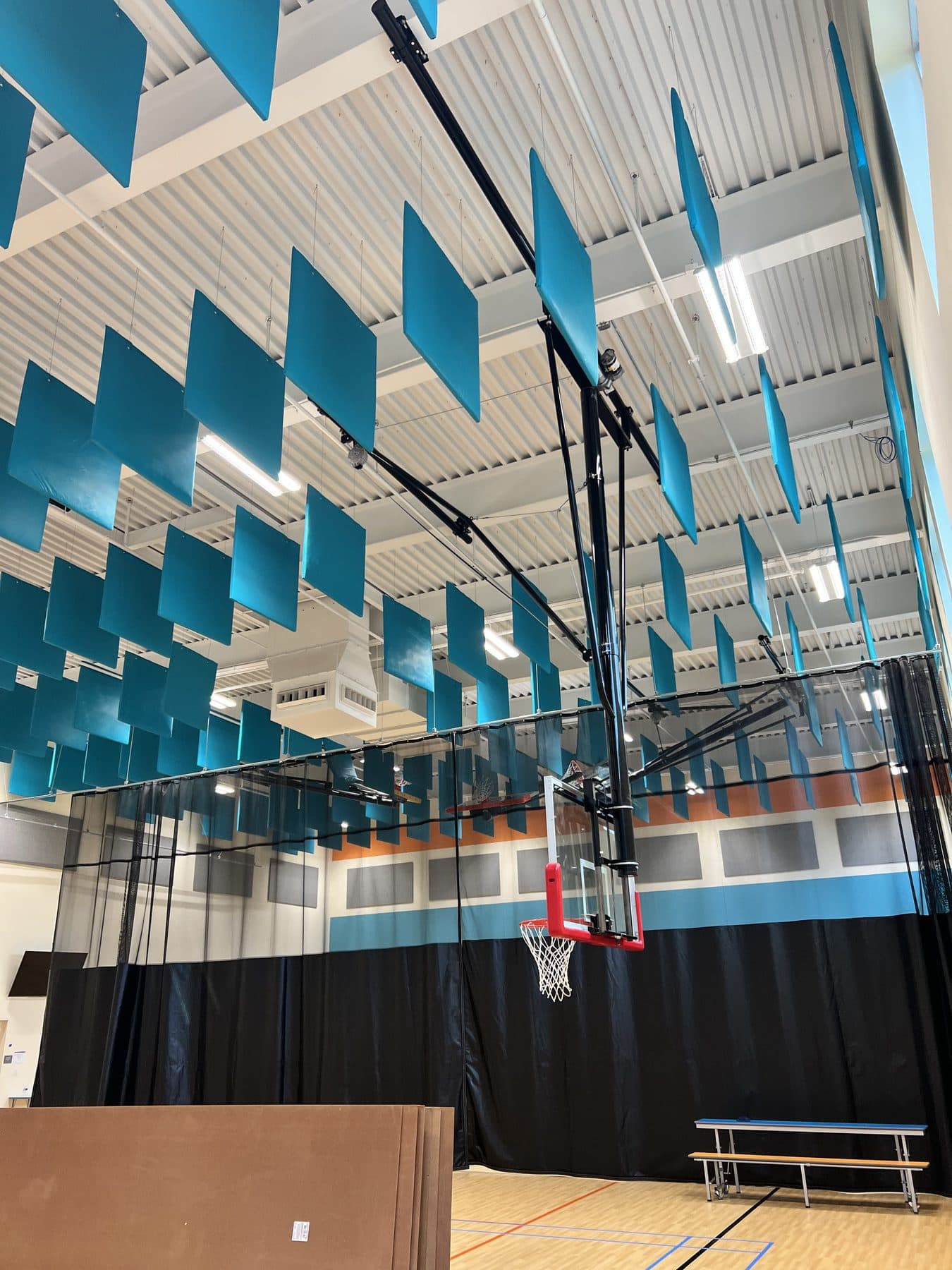 Commercial acoustic treatment in a gym with suspended baffles, Acoustics Specialty Charlotte NC