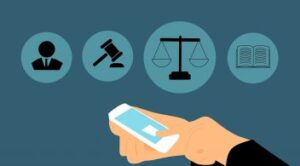 Hand Holding Smartphone With Legal Icons