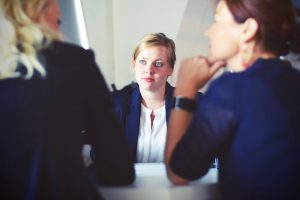 Woman Listening During A Business Meeting Or Consultation
