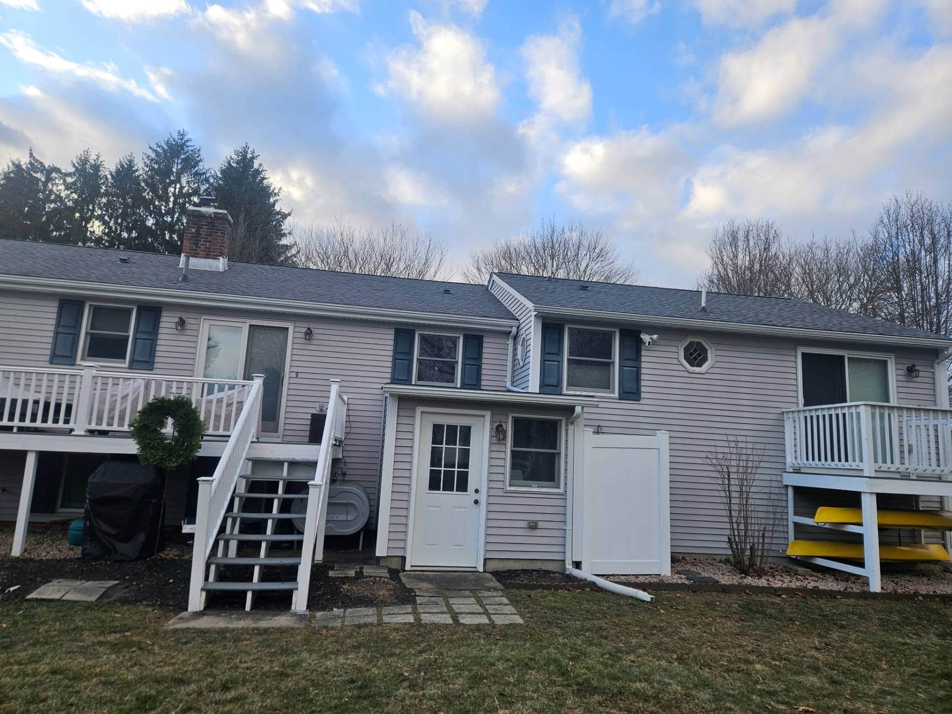 Completed colonial home roof replacement by AMP Roofing in Monroe