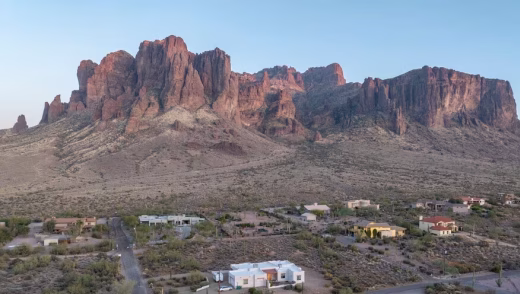 Gorgeous superstition mountains overlooking apache junction city and real estate in greater phoenix, arizona.