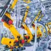 robotic arms in a car plant