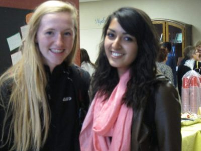 2 teen girls smiling in a Montessori hallway | Bishop Hamilton Montessori School in Ottawa