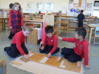 Students working in a Montessori classroom | Bishop Hamilton Montessori School in Ottawa