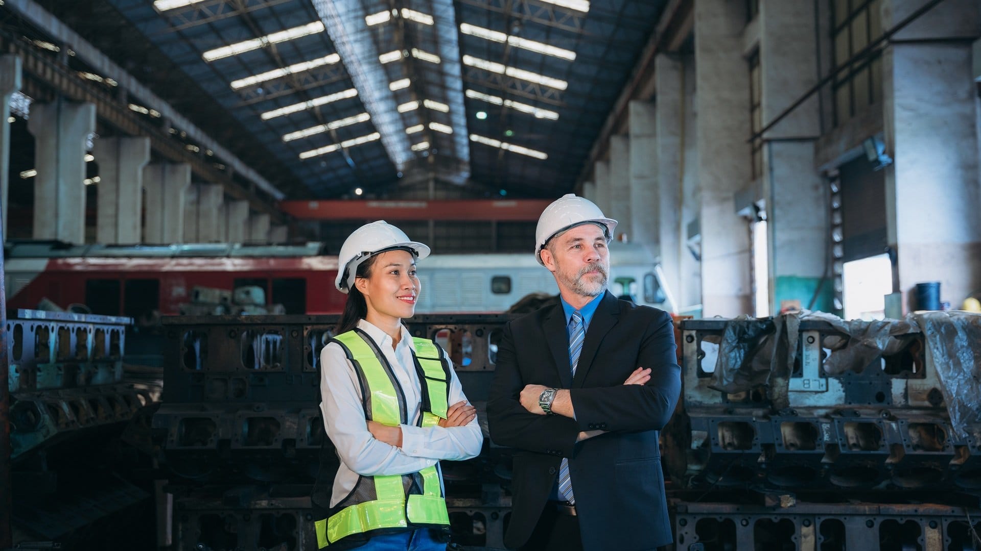 Portrait of Professional Engineers express a high level of confidence at the railway garage.