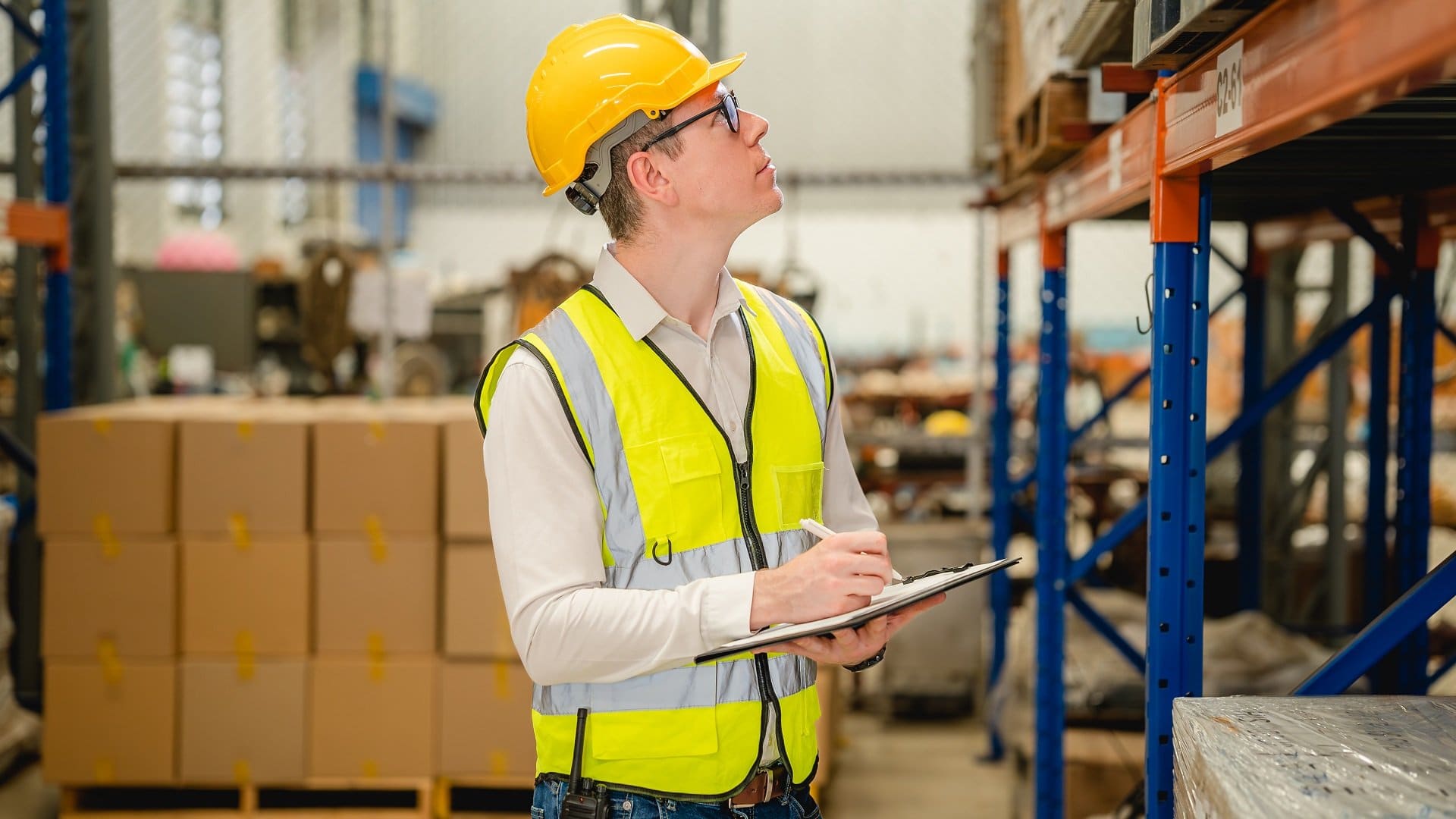 Warehouse workers talking together checking goods in storage