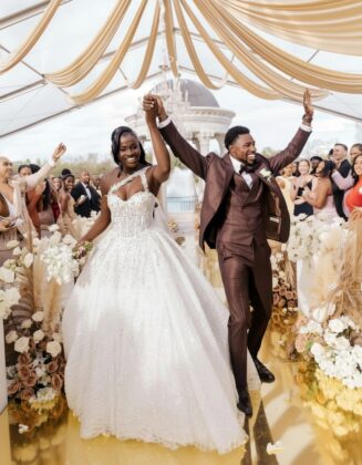 A beautiful wedding celebration showing Olympians Noah Lyles and Junelle Bromfield smiling together, representing the beautiful union of Jamaican and American cultures.