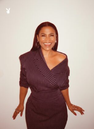 A confident portrait of actress Nia Long looking directly at the camera, exuding absolute authority and grace.