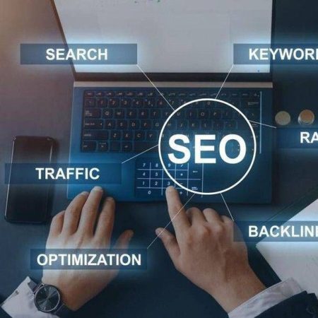 Pricing –A high-angle close-up of a person’s hands typing on a laptop with a digital overlay showing SEO keywords like Search, Traffic, Optimization, and Backlinks.