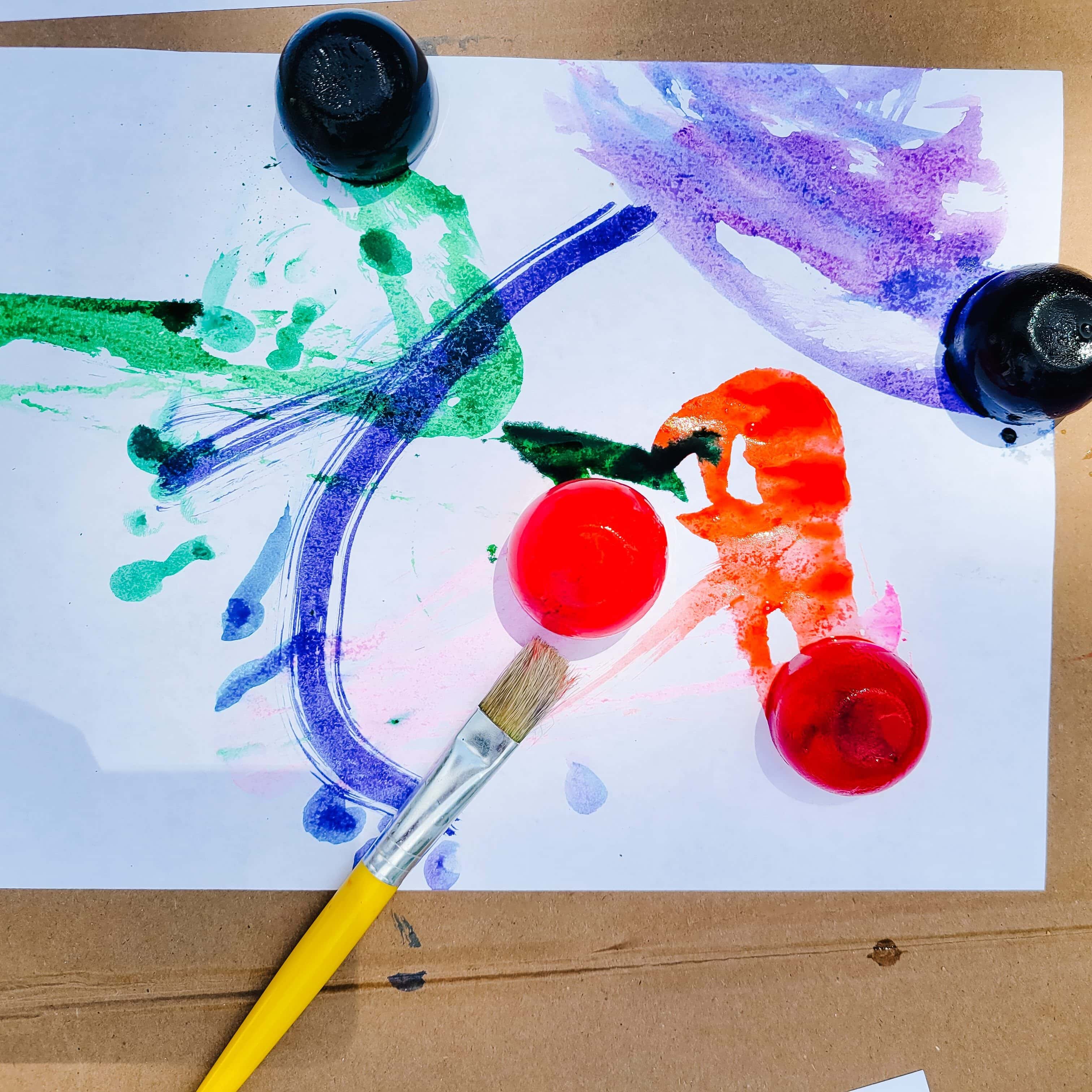 Ice Paints with paint brushes on white paper