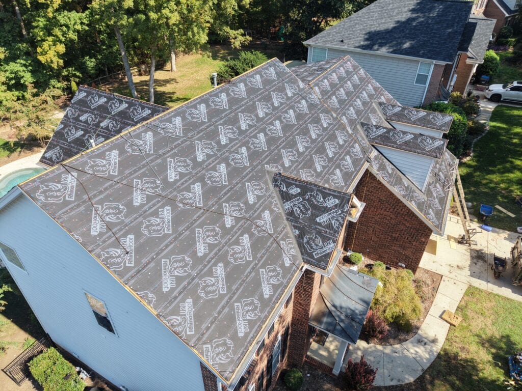 Synthetic underlayment going down during the Waxhaw roof replacement