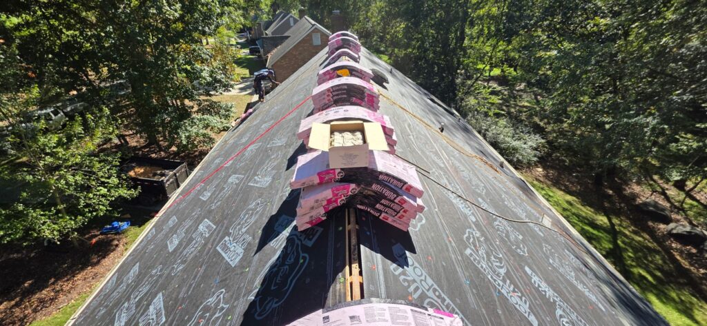 Owens Corning Duration shingle bundles staged on synthetic underlayment during the Whitethorn Dr roof replacement, Charlotte NC