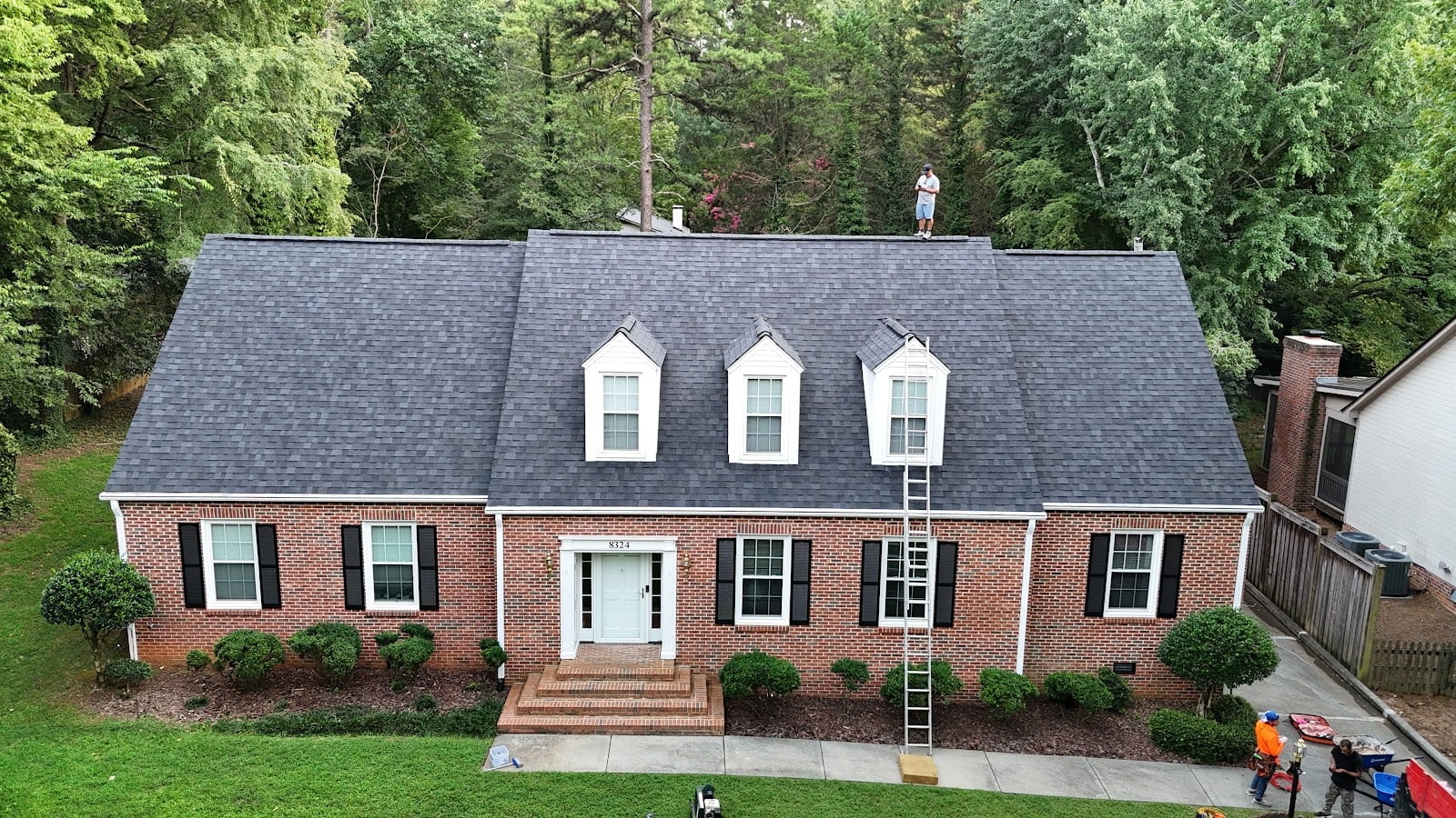 Brick colonial with dormers and a new shingle roof in Charlotte, NC