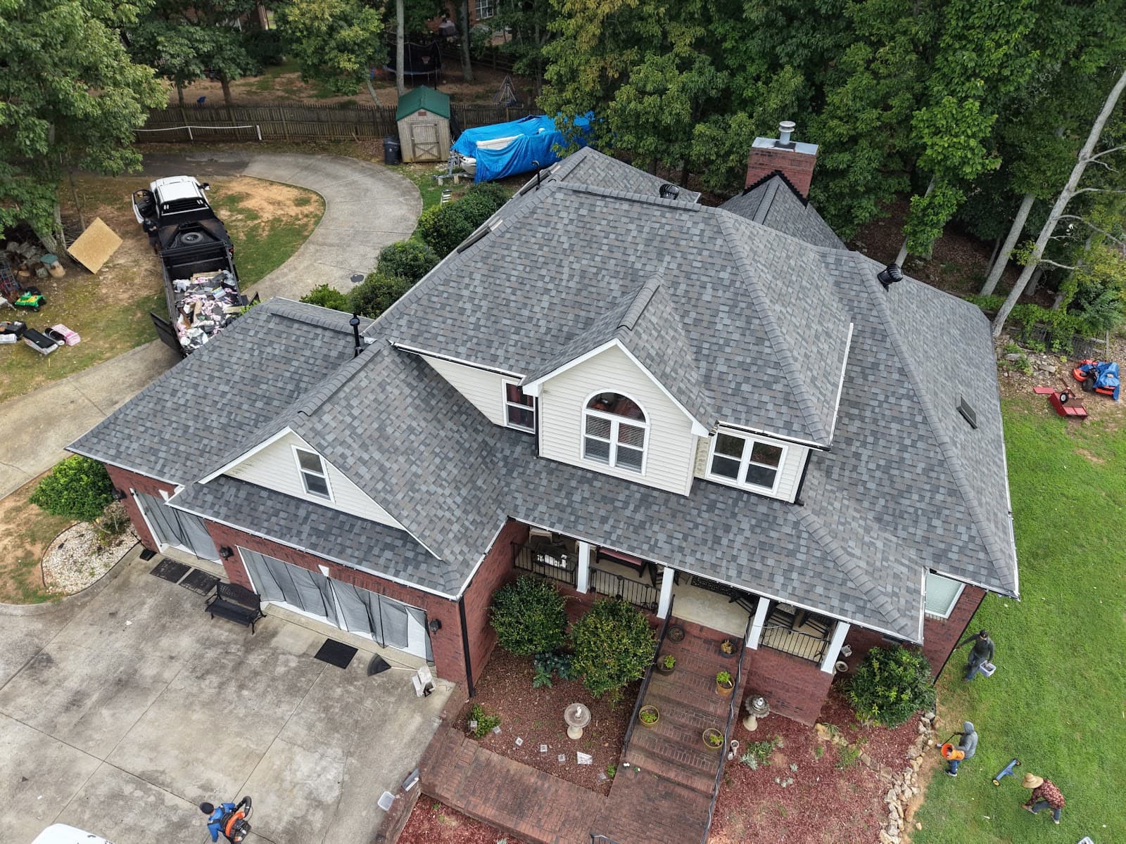 Aerial view of a finished roof replacement on a two-story home in Charlotte, NC