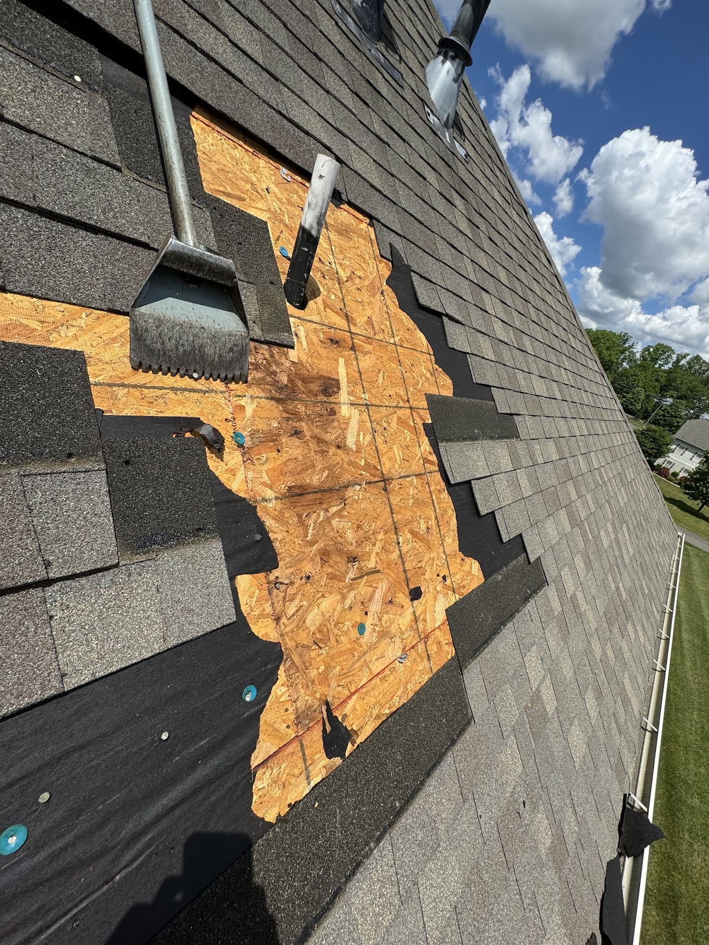 Rotted roof decking exposed during a tear-off