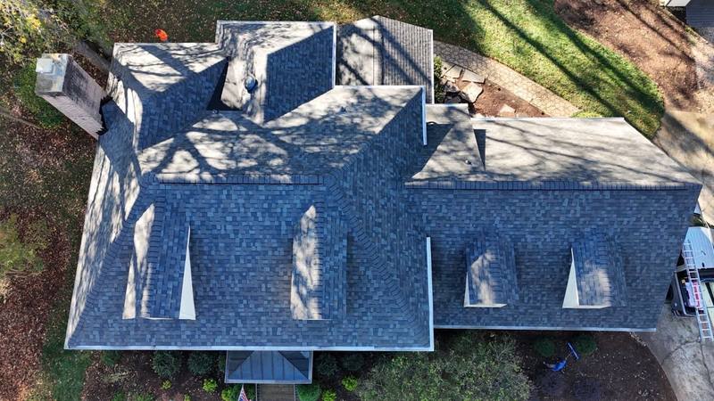 Overhead drone view of a new roof with four dormers