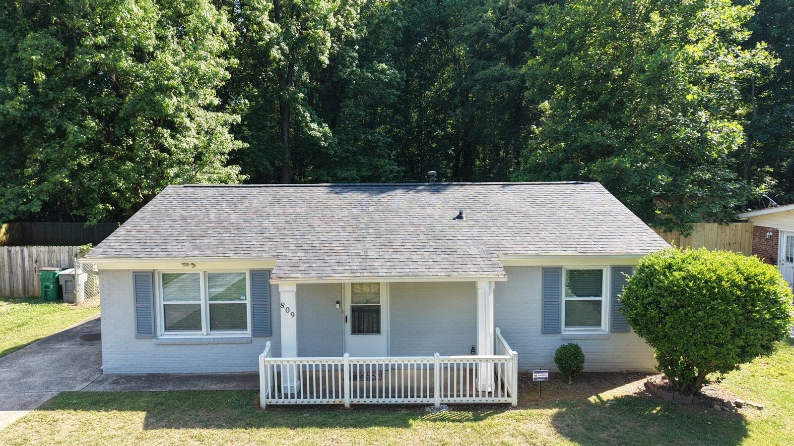 Painted brick ranch with a new architectural shingle roof near Charlotte, NC