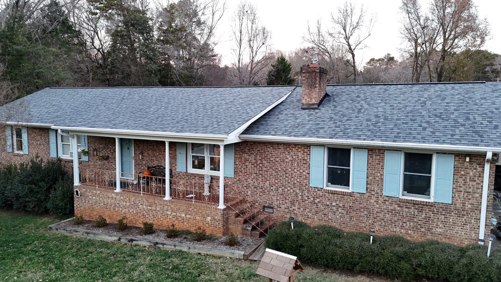 Brick ranch with a front porch and a new roof in the Charlotte area