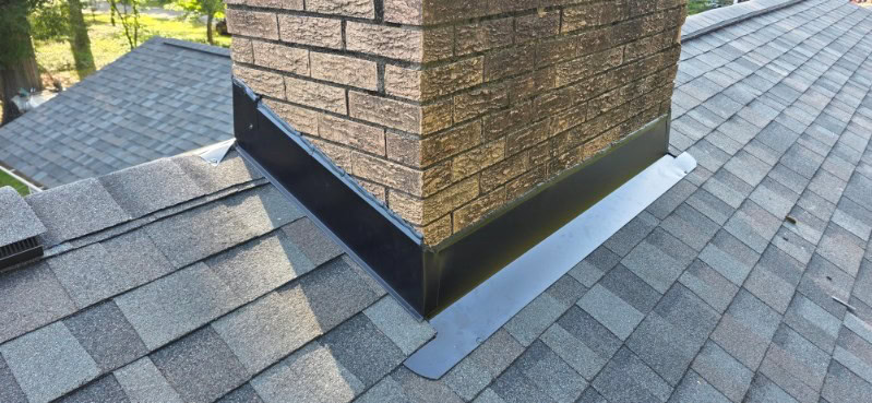 New chimney flashing on an Owens Corning Williamsburg Gray roof replacement, Monroe Rd, Charlotte NC