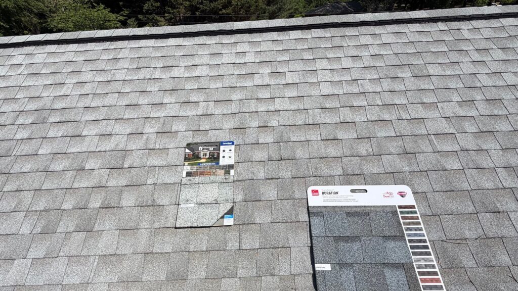 Owens Corning Duration and CertainTeed shingle samples on an aging roof during a free inspection in Mint Hill, NC