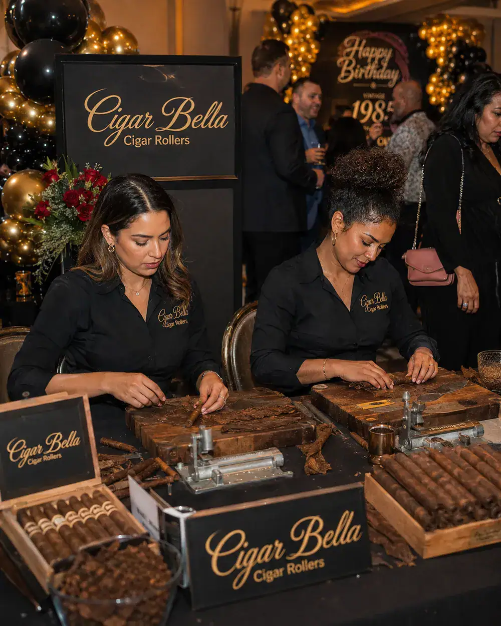 two Cigar Bella female cigar rollers providing live cigar rolling at an upscale private celebration