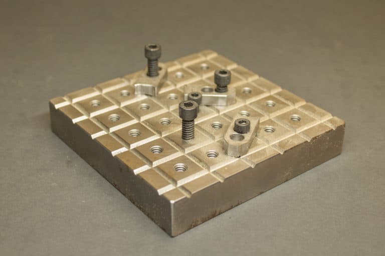 A custom fixture plate for a desktop milling machine