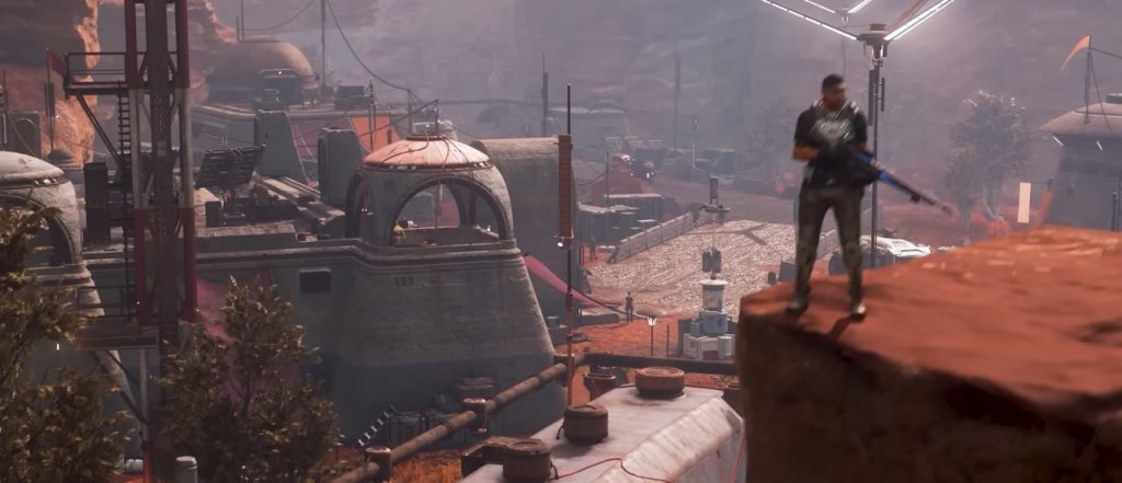 Puesto avanzado de Star Citizen con un personaje armado observando una colonia desértica futurista