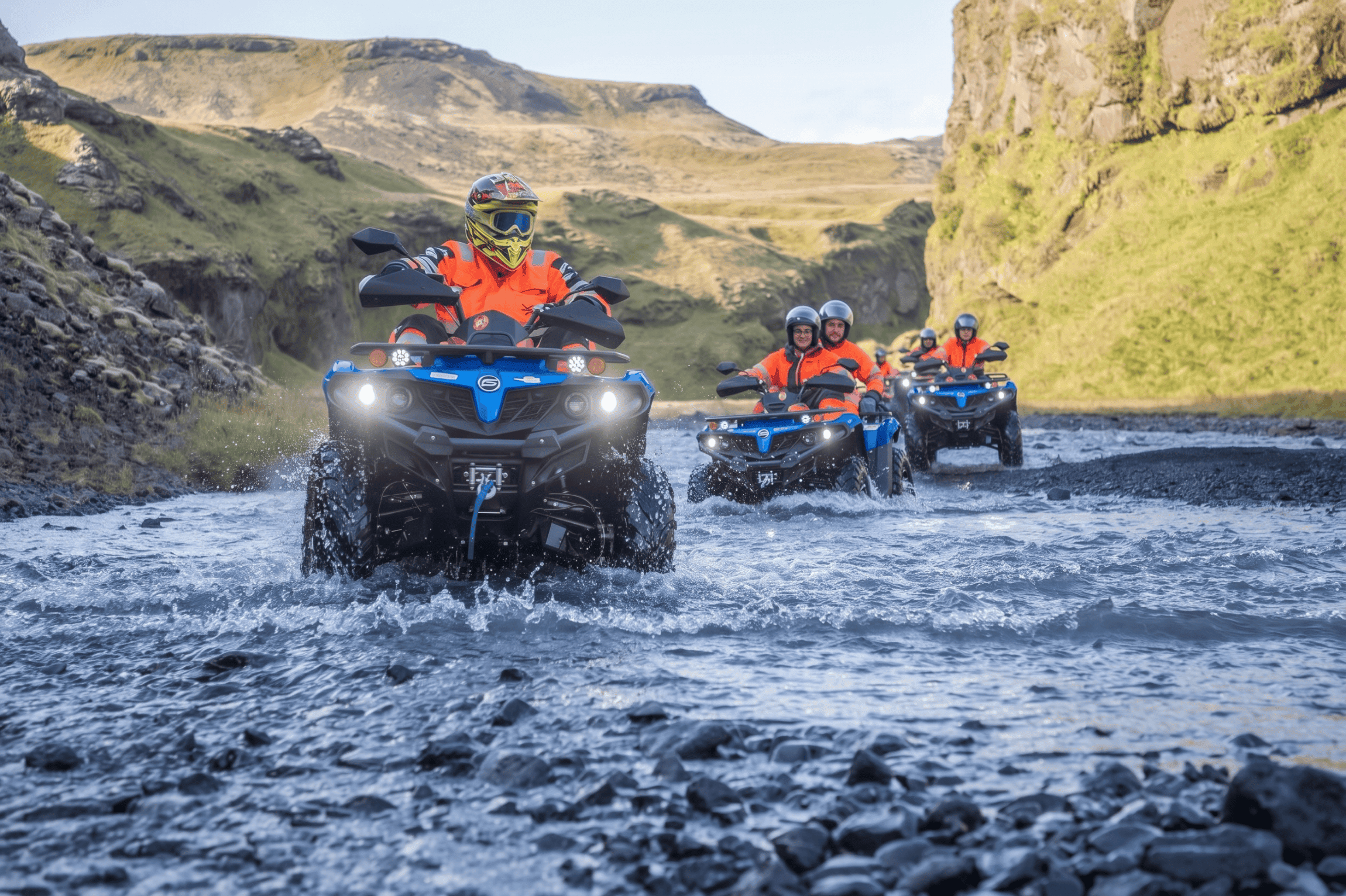 Friends riding ATVs across the black sands of Sólheimasandur in Iceland during an adventure tour