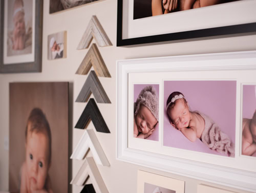 Wall of sample prints and frames