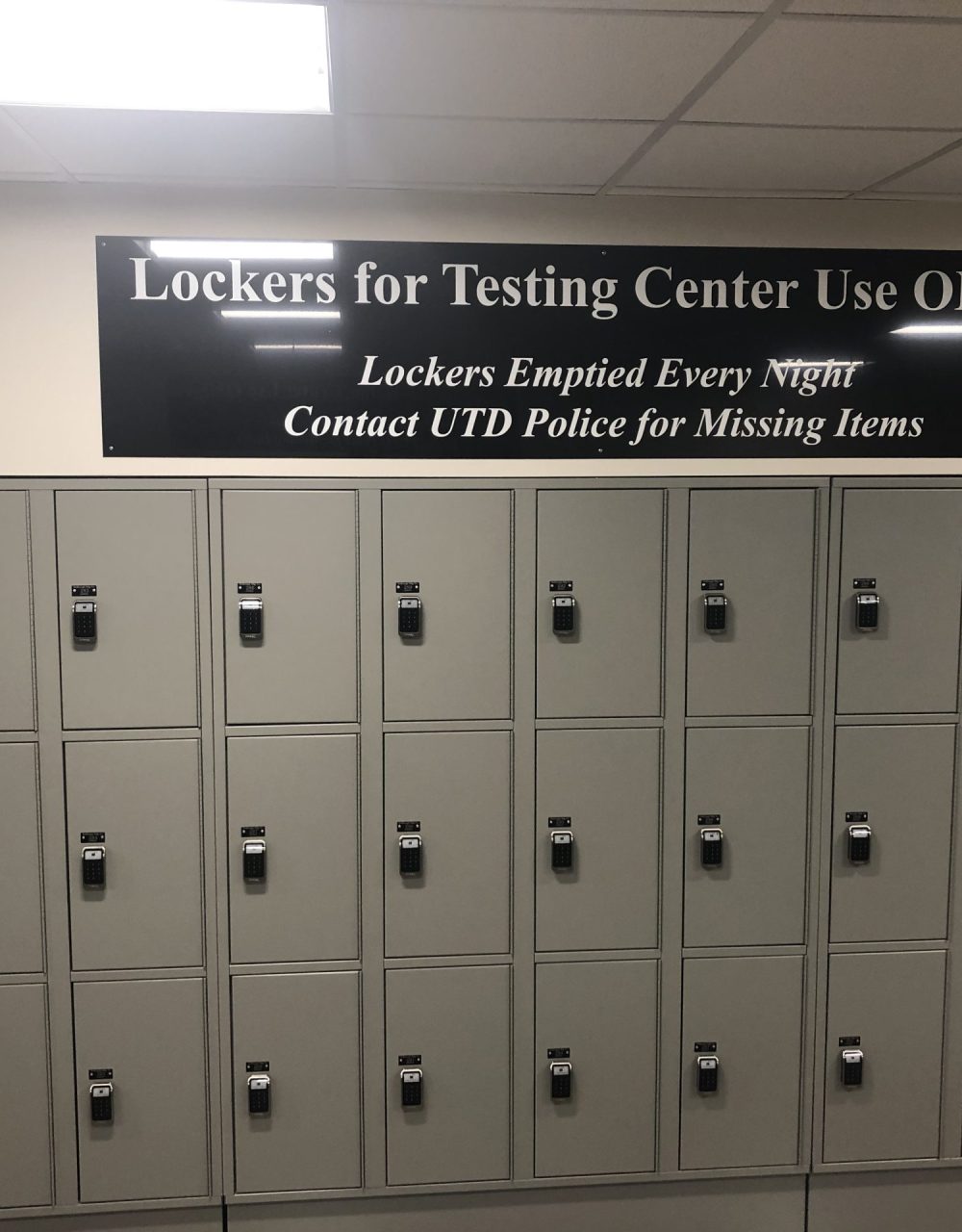 gray Volta access control lockers with a sign that says "Lockers for Testing Center Use ONLY"