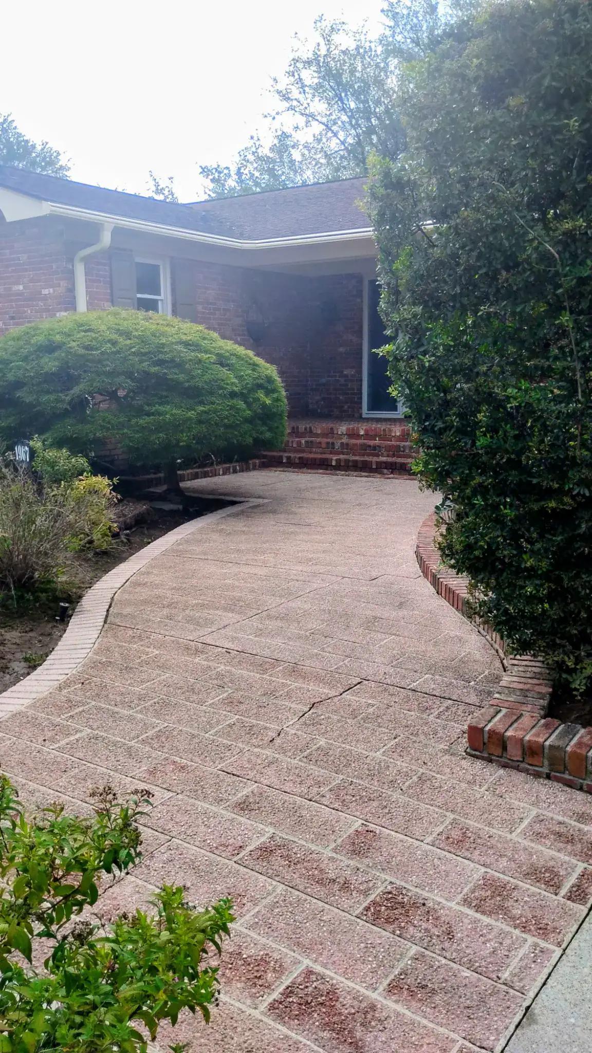 Pressure Washing and Exterior Cleaning | Charleston, SC Clean driveway and brick home after DSS Cleaning service in Charleston, South Carolina