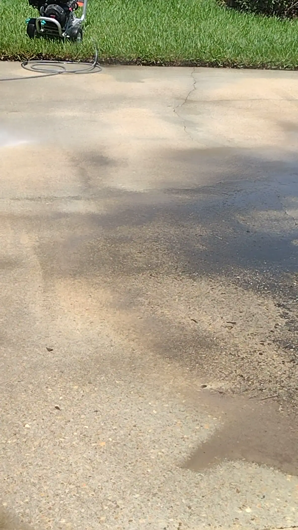 Pressure Washing and Exterior Cleaning | Charleston, SC DSS Cleaning technician pressure washing a concrete driveway in Charleston, South Carolina