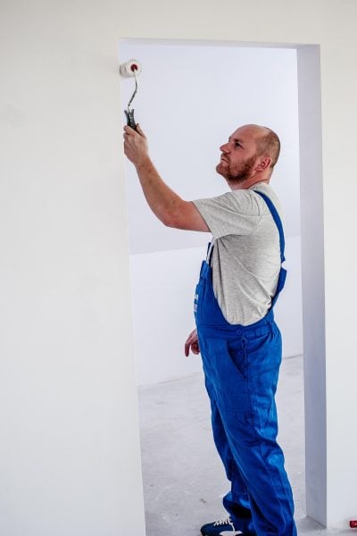 Paiting a wall to get the property ready to be rented out