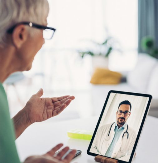 Senior woman having an online consultation with her doctor